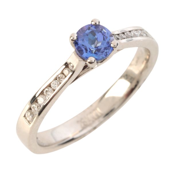 A TANZANITE AND DIAMOND RING