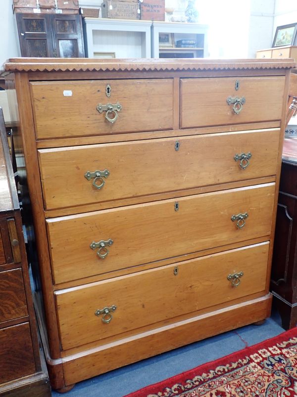 A VICTORIAN VARNISHED PINE CHEST OF DRAWERS