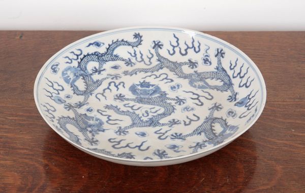 A CHINESE PORCELAIN BLUE AND WHITE 'DRAGON' DISH