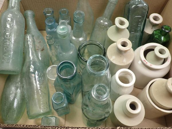 A COLLECTION OF GLASS AND STONEWARE BOTTLES