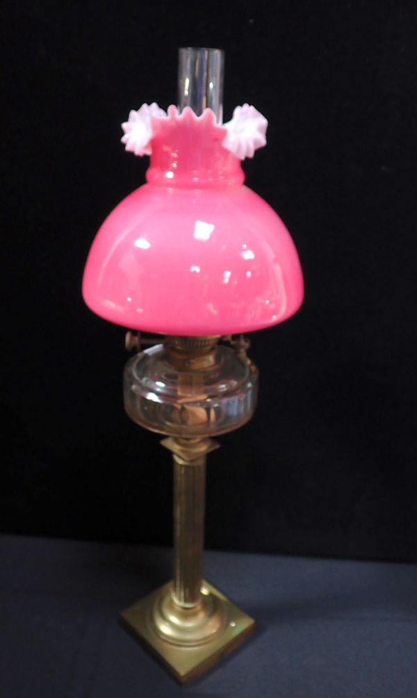 A VICTORIAN OIL LAMP WITH PINK FRILLED GLASS SHADE