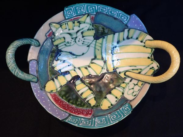A POTTERY HANDLED DISH, WITH GLAZED CAT