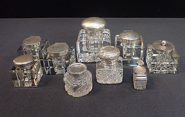 A COLLECTION OF SILVER-MOUNTED GLASS INKWELLS