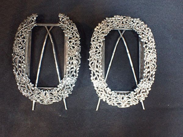 A PAIR OF EASTERN WHITE METAL PHOTOGRAPH FRAMES