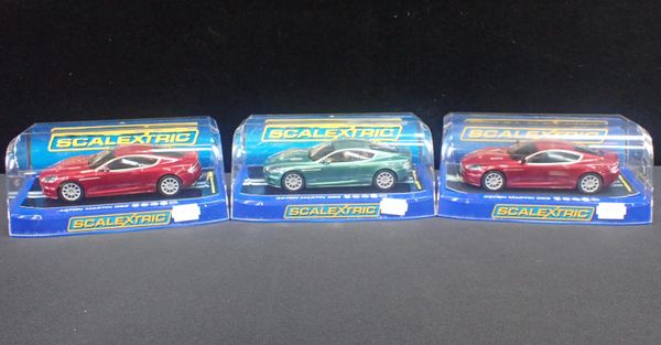 THREE BOXED SCALEXTRIC 'ASTON MARTIN DBS' CARS