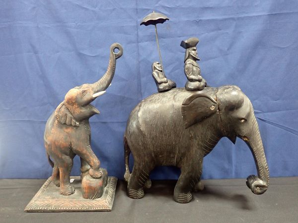 TWO CEYLONESE CARVED HARDWOOD ELEPHANTS