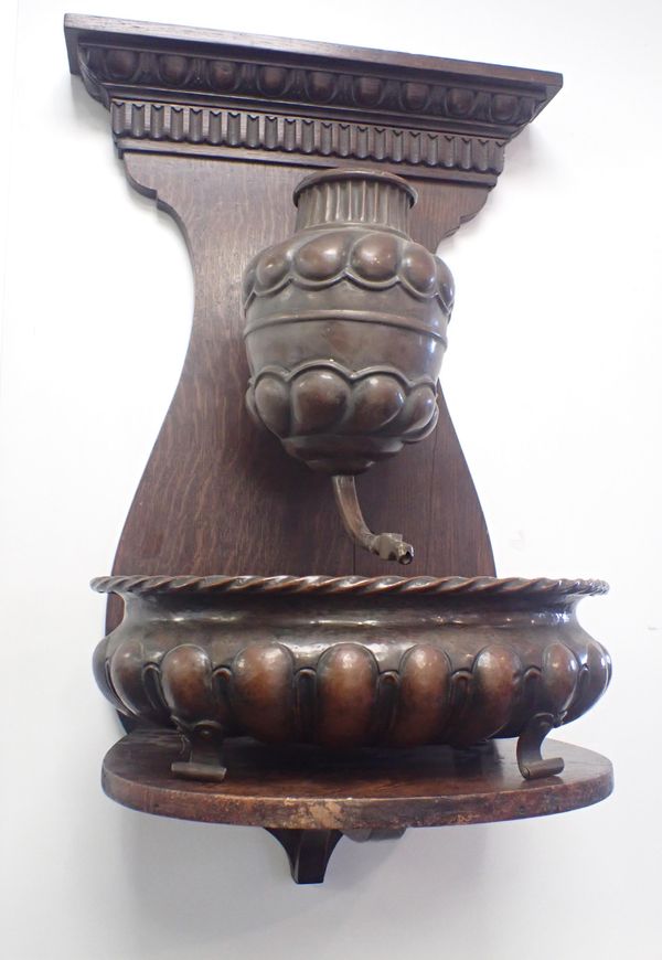 A RENAISSANCE STYLE COPPER WALL-MOUNTED LAVABO