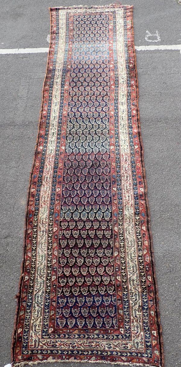 AN OLD NORTH-WEST PERSIAN LONG COUNTRY HOUSE RUNNER