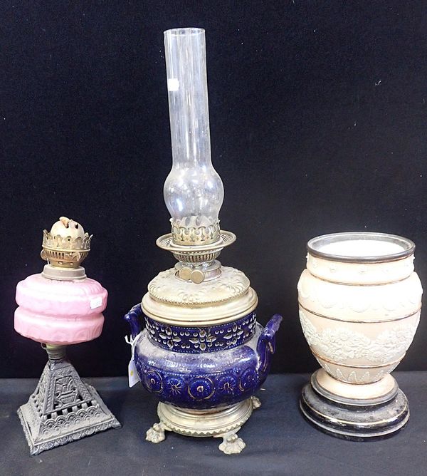 A VICTORIAN OIL LAMP WITH CERAMIC AND BRASS BASE