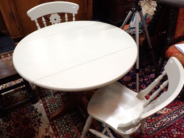 A PINE KITCHEN TABLE WITH DROP FLAPS