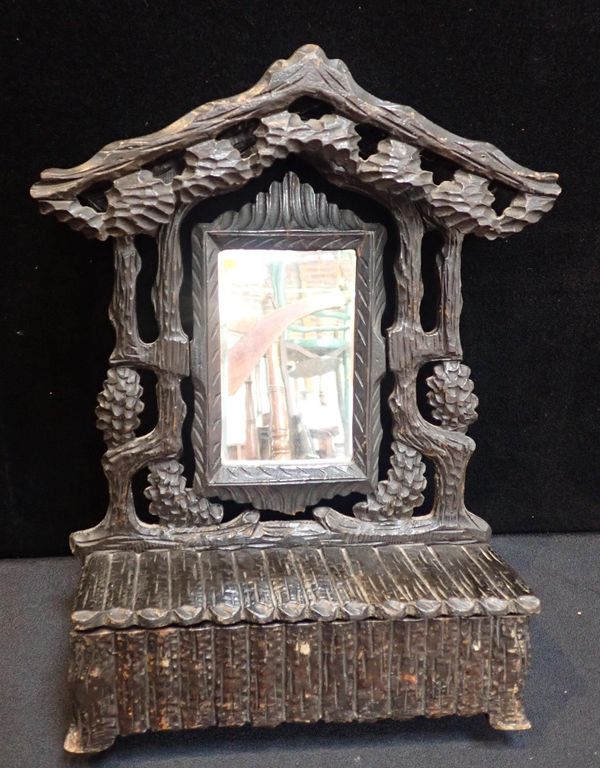 A BLACK FOREST TABLE MIRROR