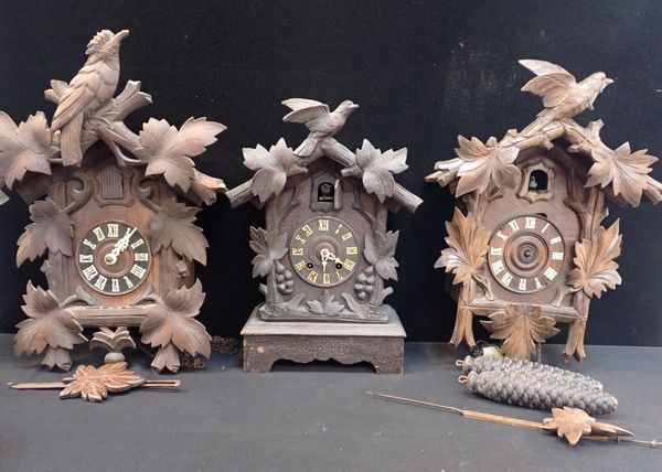 A BLACK FOREST SHELF CUCKOO CLOCK