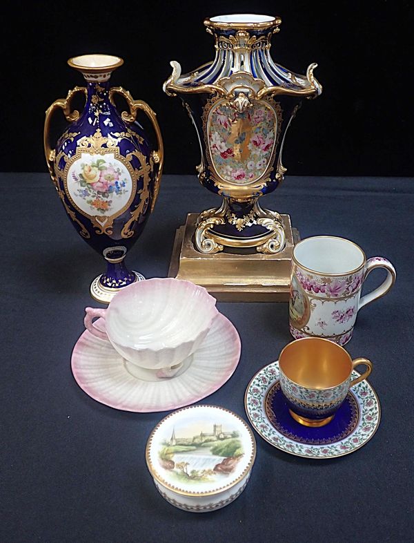 A ROYAL WORCESTER MINIATURE CABINET CUP AND SAUCER