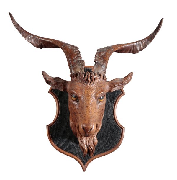 A BLACK FOREST CARVING OF A GOAT NECK MOUNT