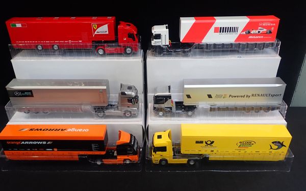 TEN BOXED 'IVECO STRALIS' DIECAST F1 RACING TEAM TRANSPORTERS