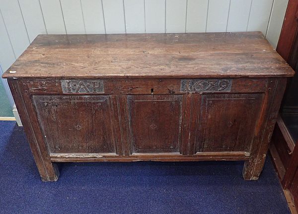 AN OAK PANELLED CHEST, WITH CARVED DATE '1679'