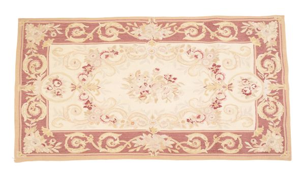 A NEEDLEWORK RUG