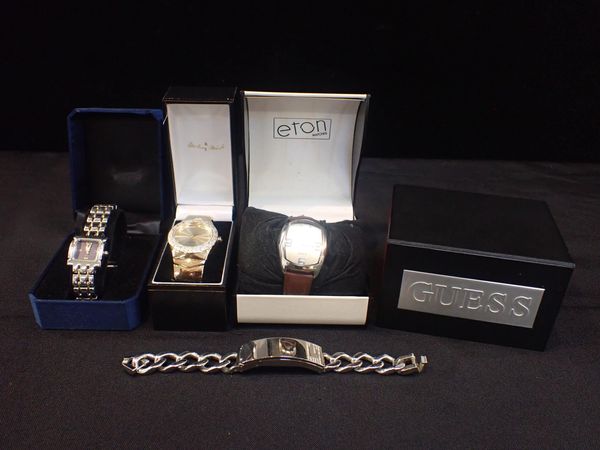 GUESS: A SILVER-PLATED BRACLET WATCH