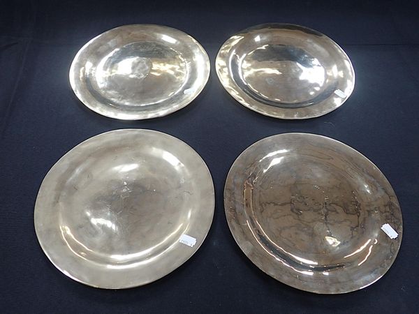 A SET OF FOUR BRASS PLATES