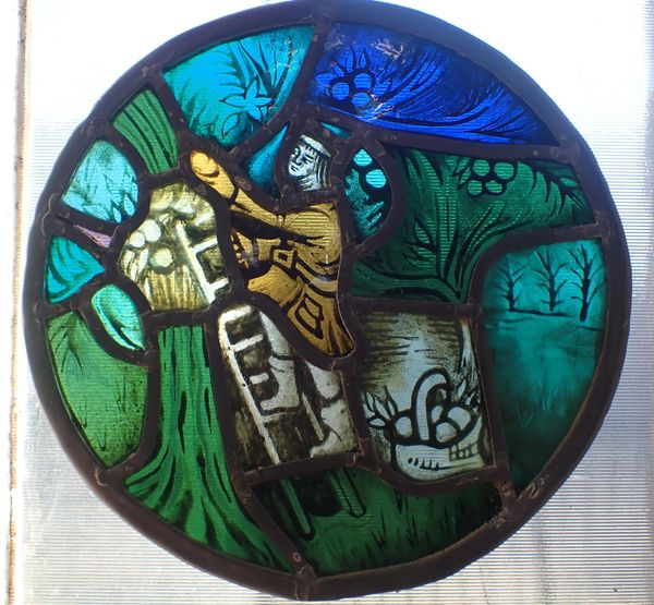 A MEDIEVAL STYLE STAINED GLASS ROUNDEL