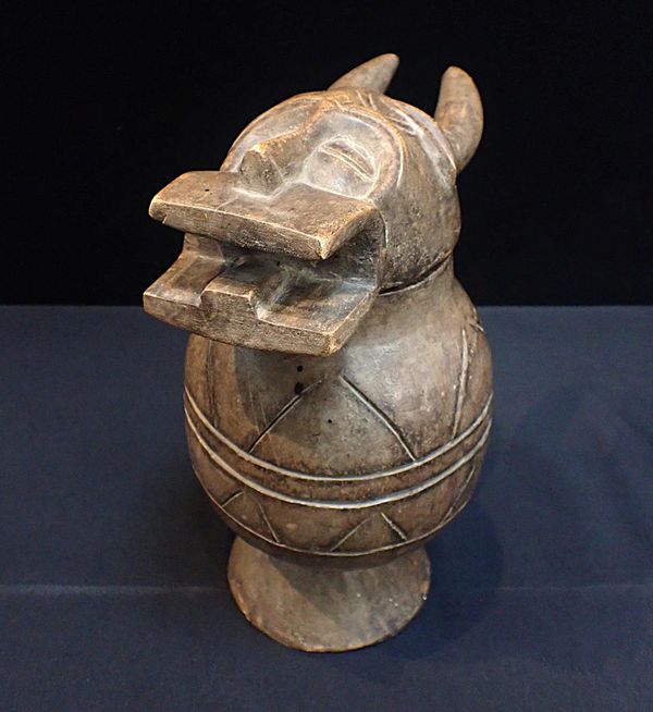 AN AFRICAN TRIBAL CARVED WOODEN POT