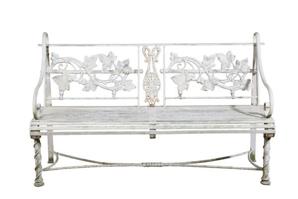 A WHITE-PAINTED CAST IRON GARDEN BENCH