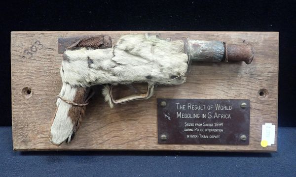 A DUMMY HANDGUN COVERED IN FUR, PROBABLY ZULU