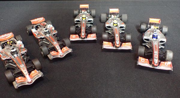 FIVE UNBOXED SCALEXTRIC 'McLAREN' F1 CARS