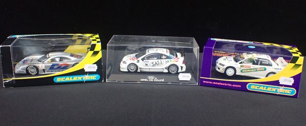 THREE BOXED SCALEXTRIC CARS