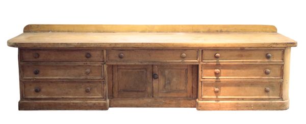 A 19TH CENTURY STRIPPED PINE HABERDASHERY COUNTER