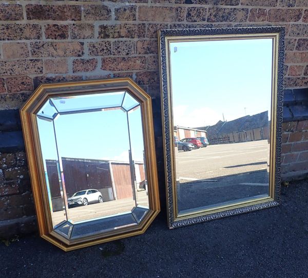 A MOULDED AND GILT FRAMED MIRROR