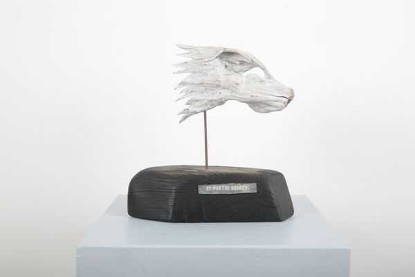 MARTIN SCOREY (1961-2021): A CARVED WOOD HEAD OF A FOLK ART WOLF