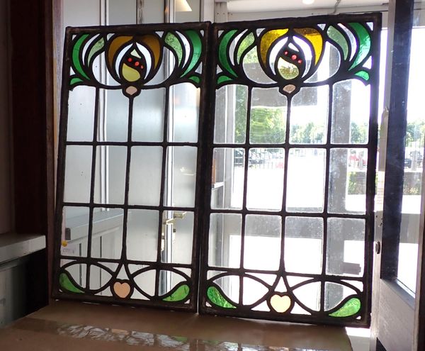 A PAIR OF ART NOUVEAU STYLE LEADED GLASS PANELS