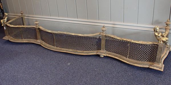 A LOUIS XV STYLE GILT BRASS FENDER