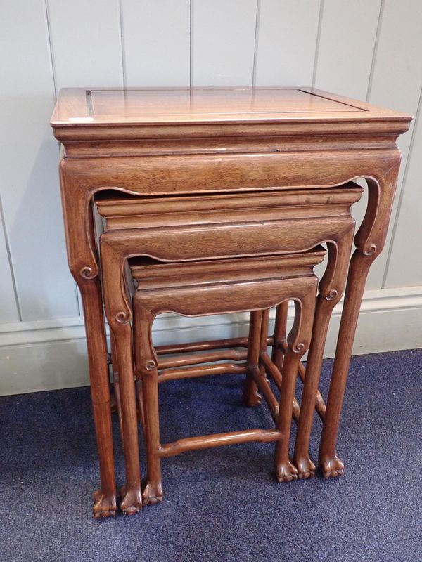 A CHINESE HARDWOOD NEST OF THREE TABLES