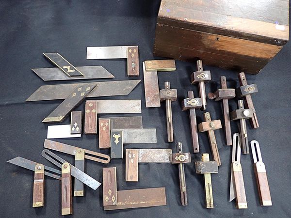 A COLLECTION OF OLD BRASS MOUNTED SQUARES