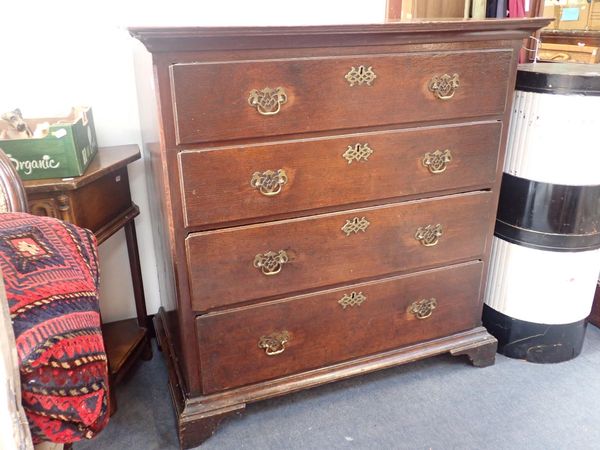 A GEORGE III OAK CHEST OF DRAWERS