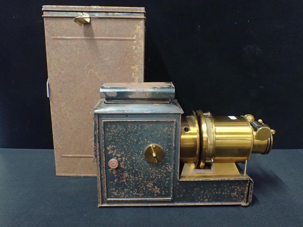 A LACQUERED BRASS AND TIN PLATE MAGIC LANTERN WITH CASE