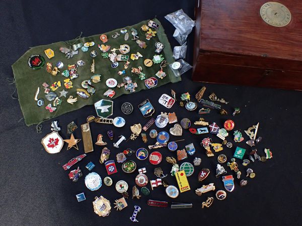 A COLLECTION OF ENAMEL BADGES