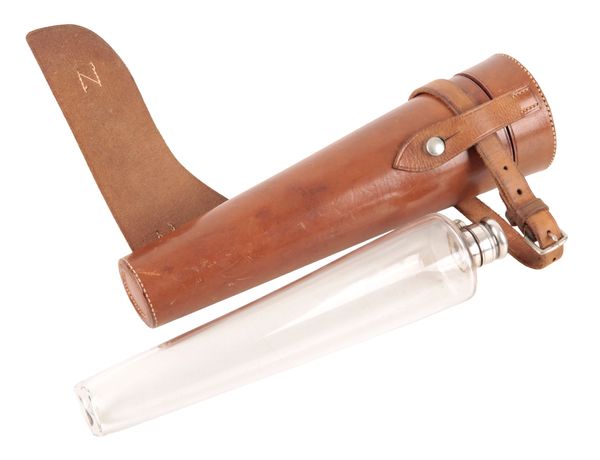AN EDWARDIAN TAPERED LEATHER HUNTING FLASK WITH GLASS BOTTLE
