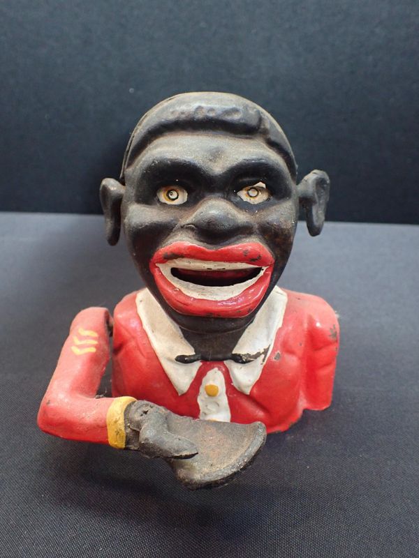 A CAST IRON AMERICAN NOVELTY MONEY BOX