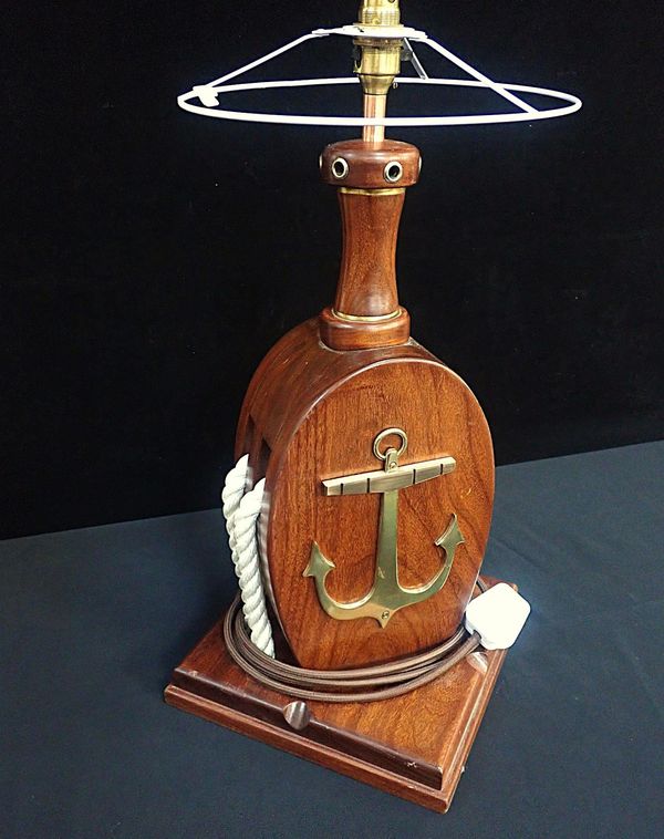 A WOODEN NAUTICAL LAMP