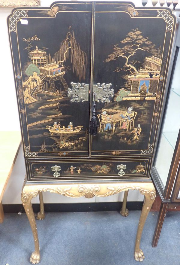 A BLACK LACQUERED CHINOISERIE DRINKS CABINET