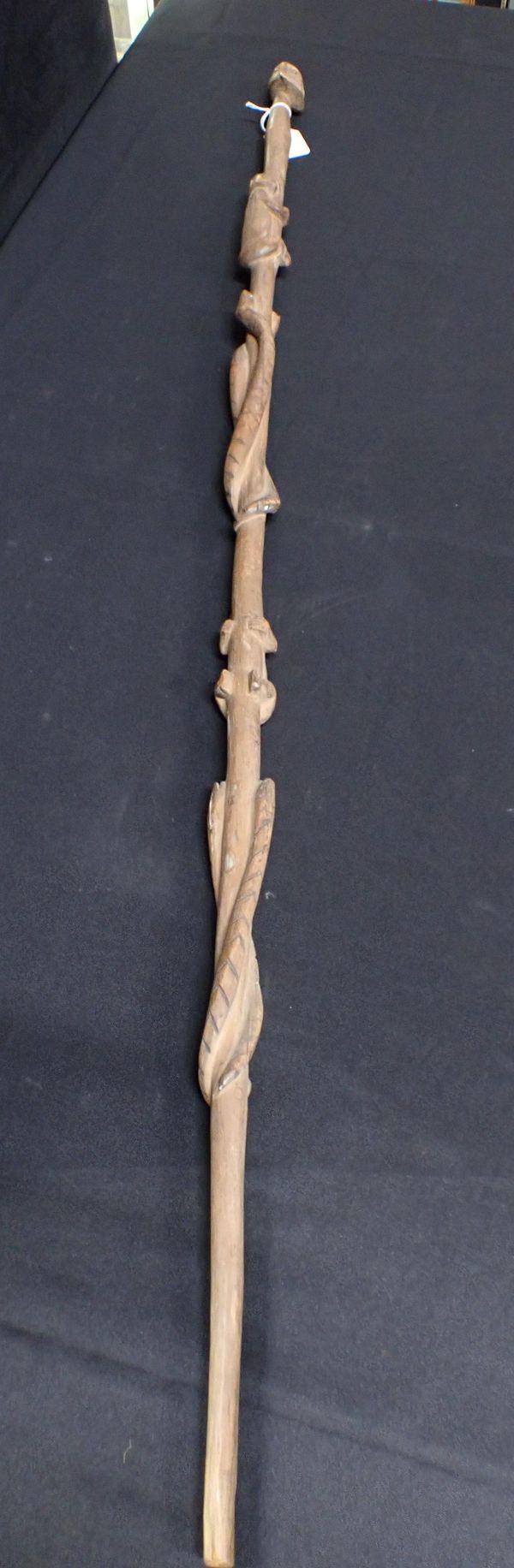 AN AFRICAN STAFF OR WALKING STICK CARVED WITH SNAKES AND CLIMBING FIGURES