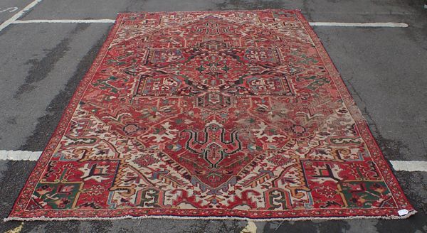 A LARGE HERIZ RUG