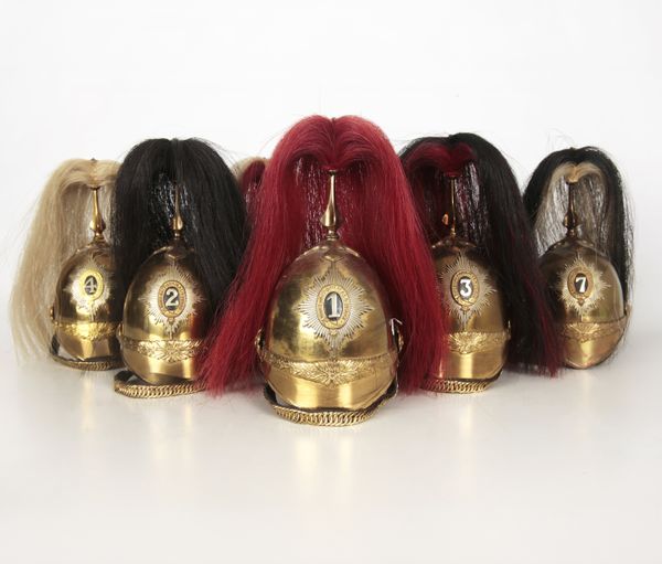 SEVEN MODEL BRASS CAVALRY HELMETS WITH HORSEHAIR PLUMES