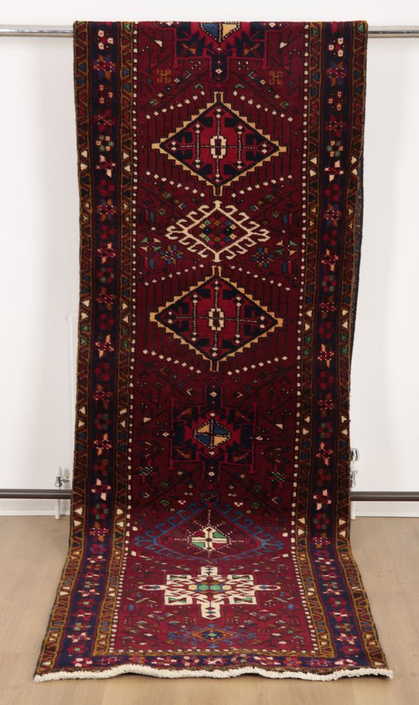 A NORTH WEST PERSIAN HERIZ STYLE RUNNER