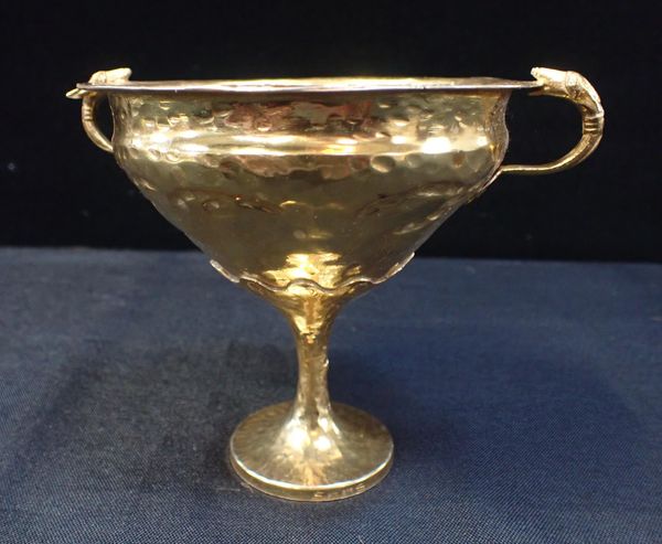 AN EASTERN FOOTED GILT CUP