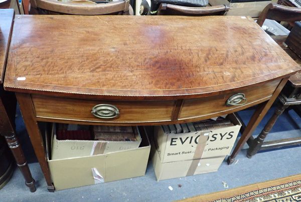 A GEORGE III FIGURED MAHOGANY BOWFRONT SIDE TABLE