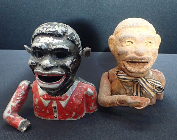 A CAST IRON AMERICAN NOVELTY MONEY BOX